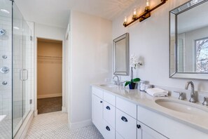 Bathtub, hair dryer, towels, soap