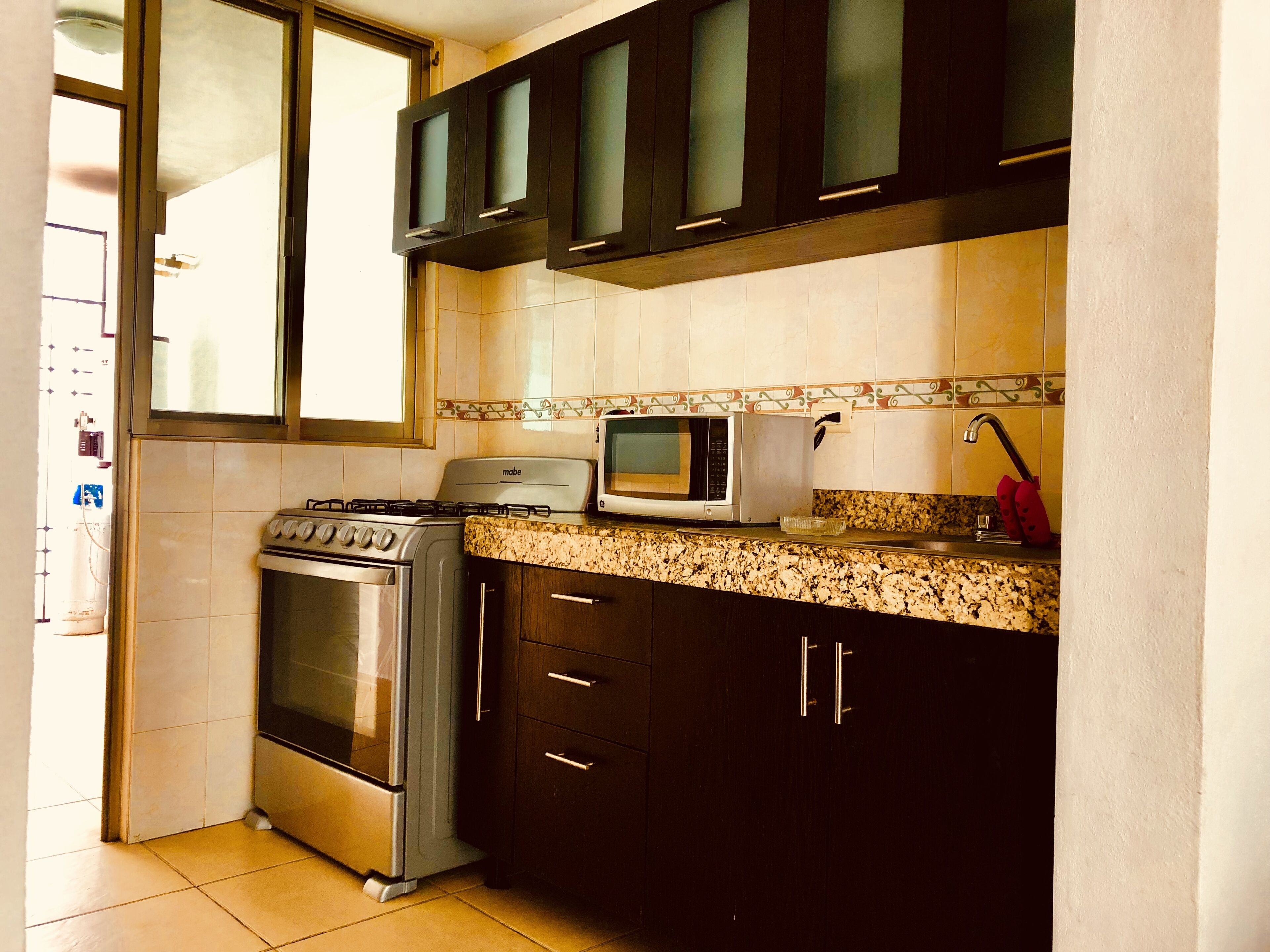 Microwave, coffee/tea maker, cookware/dishes/utensils