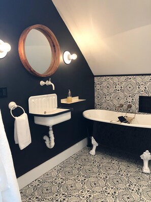 Bathtub, hair dryer, towels, soap