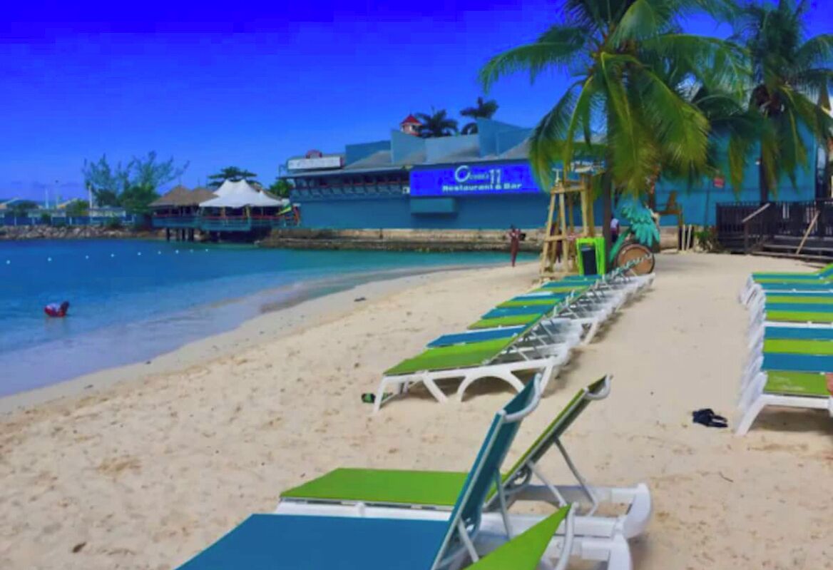 On the beach, sun loungers, beach towels