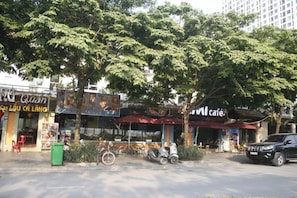 Experience the vibrant local culture in this charming street scene, lined with restaurants and shops.