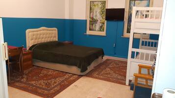 Premium bedding, desk, laptop workspace, blackout drapes