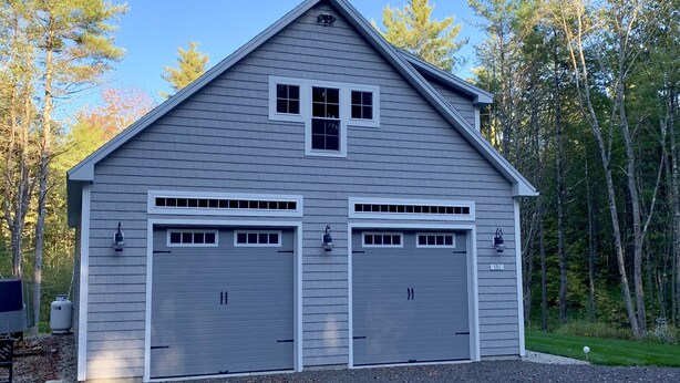 A two-story building with a gabled roof and two garage doors. - Goose Rocks Retreat - relax, refresh, recharge  (Kennebunkport)