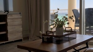 A wooden table with a white vase and a black basket on it. - “Barefoot Bliss” - Two GulfFront Masters w/balcony (Panama City Beach)