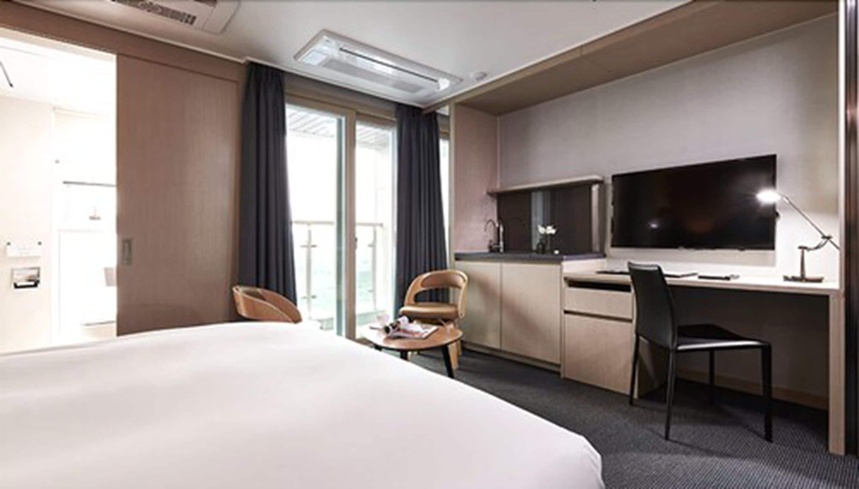 double room | premium bedding, down duvets, blackout curtains, iron/ironing board