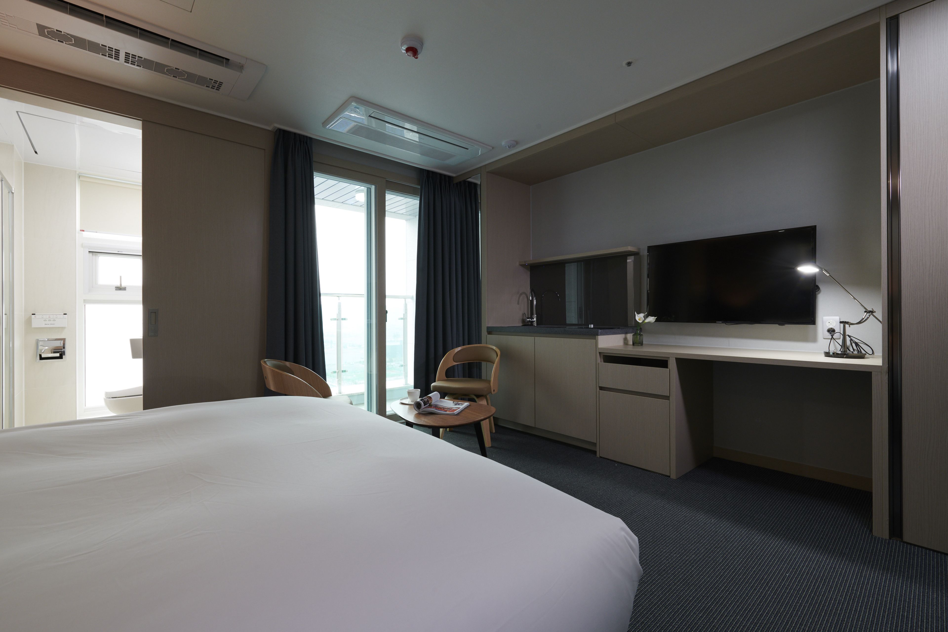 double room | premium bedding, down duvets, blackout curtains, iron/ironing board