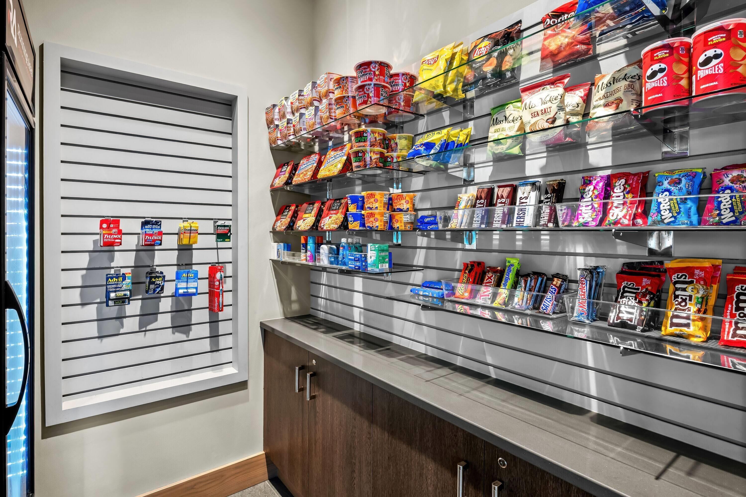 A snack display with various packaged foods and beverages.