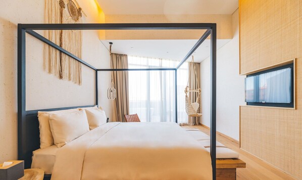 A modern hotel room with a four-poster bed, a hanging chair, and a large window with curtains. - Atour S Hotel (Guangzhou)