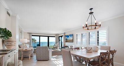 Direct oceanfront 2/2 corner condo with large wrap-around balcony and heated pool