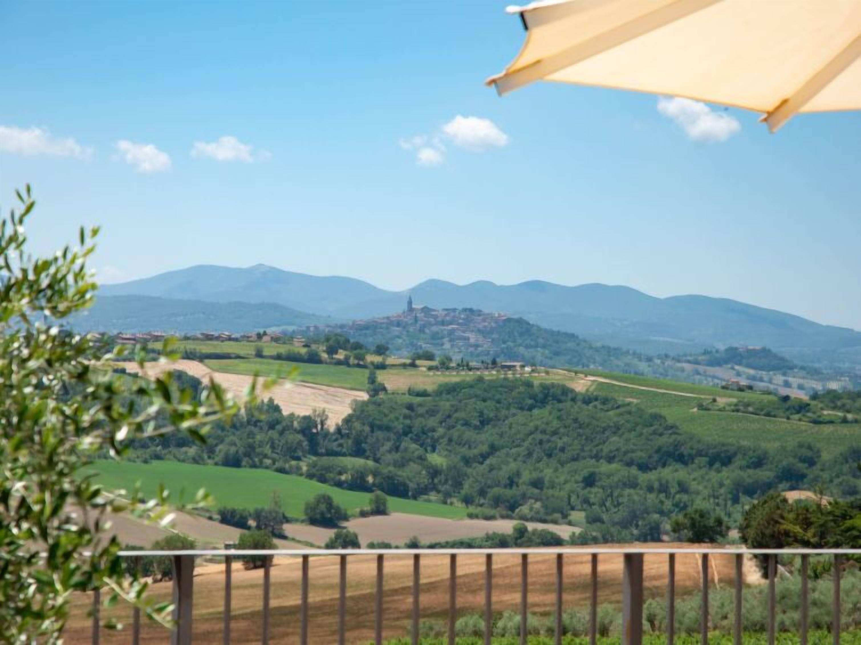 A scenic view of a mountainous landscape with a village in the valley.