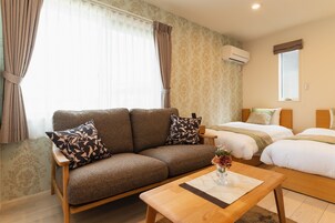 Deluxe Room A, Non Smoking | Living room | Flat-screen TV