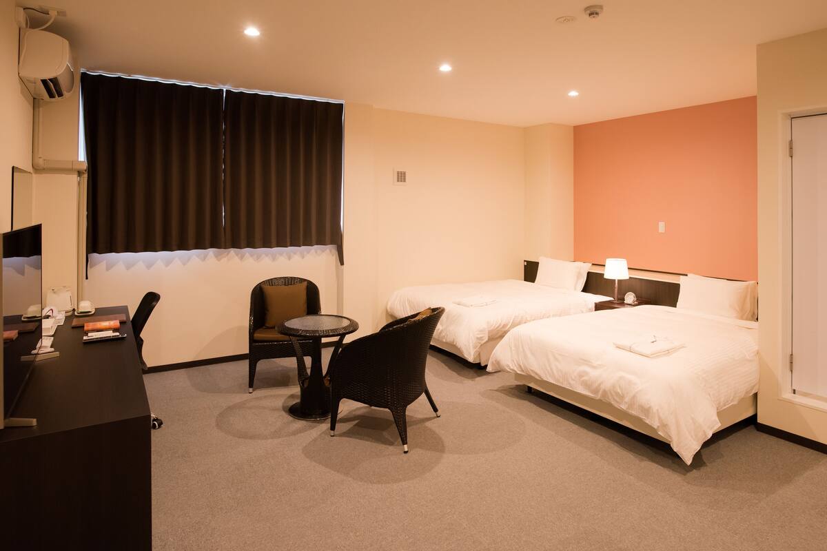 Twin Room, Non Smoking | Down comforters, desk, laptop workspace, blackout drapes