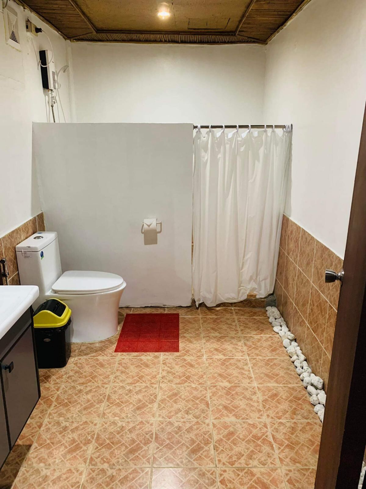 premium studio suite | bathroom | shower, slippers, bidet, towels
