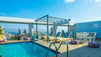 Outdoor pool, open 7:00 AM to 9:00 PM, pool umbrellas, pool loungers