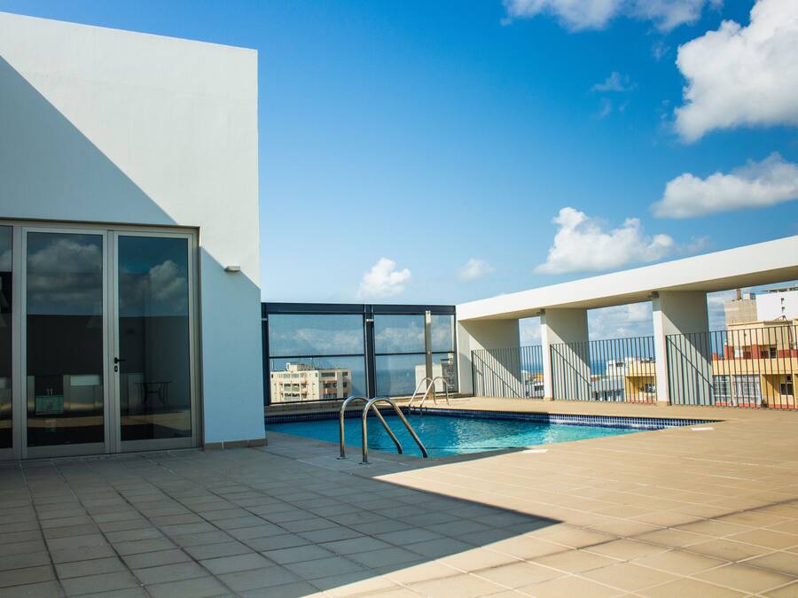 Outdoor pool, open 7:00 AM to 9:00 PM, pool umbrellas, sun loungers