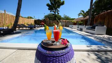 Outdoor pool, open 9:00 AM to 9:00 PM, pool loungers