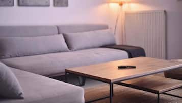 Apartment, 1 Bedroom (1.2) | Living area | 60-cm TV with cable channels