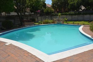 Outdoor pool, pool umbrellas, pool loungers - The Swiss Guesthouse (Randburg)