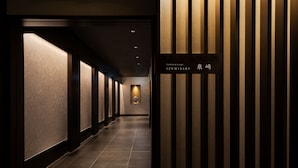 A corridor with a sign indicating room number 1. - Okinawa Harborview Hotel (Naha)