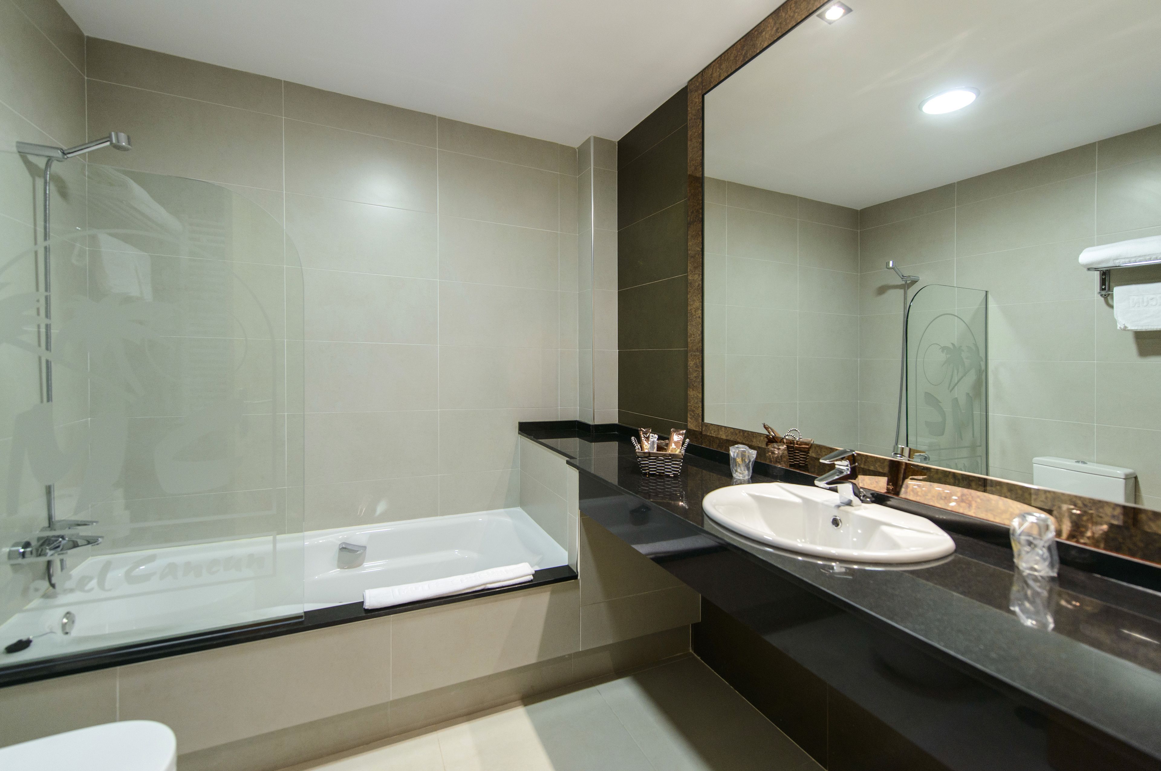 bathtub, free toiletries, slippers, bidet