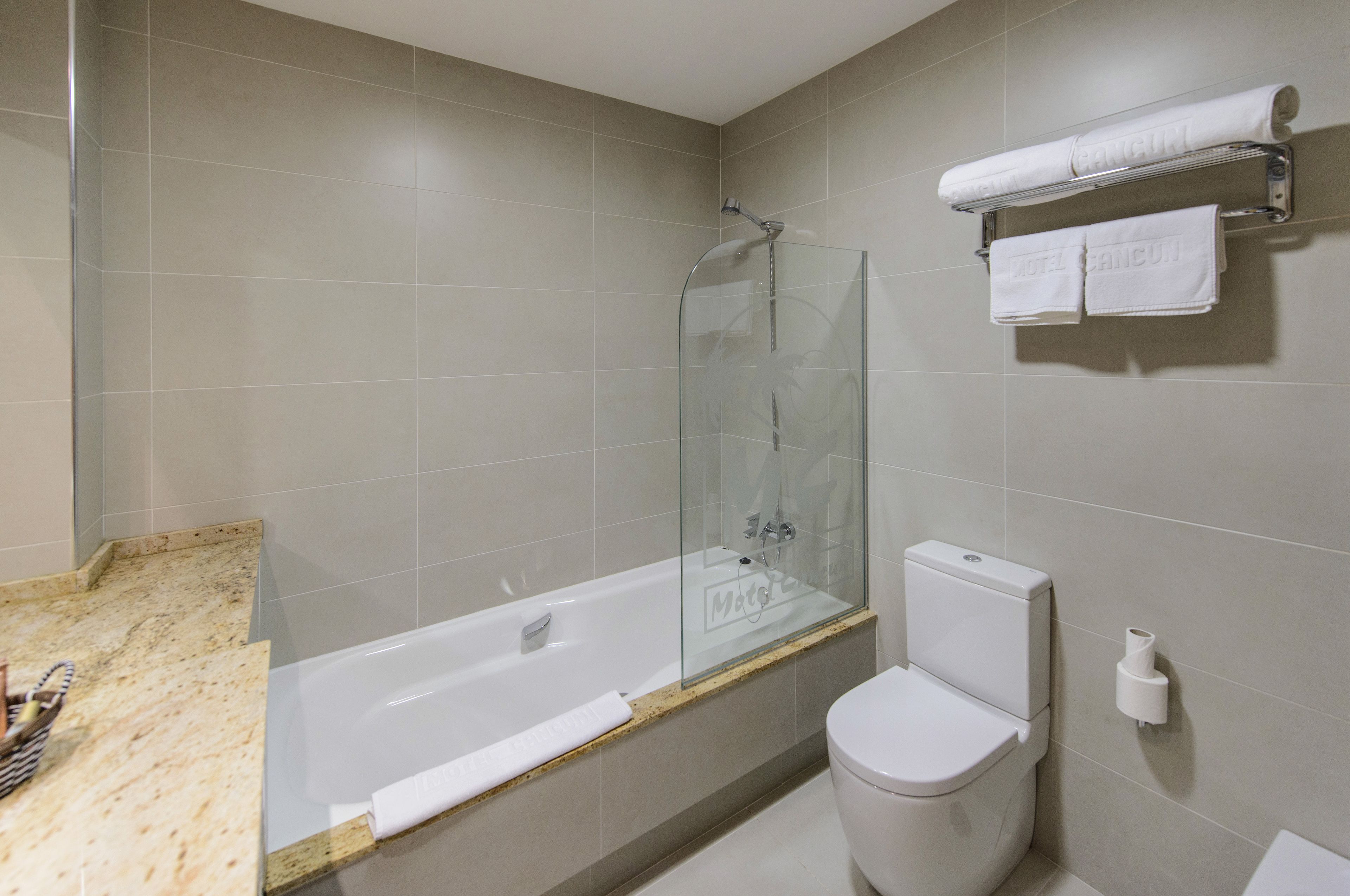 bathtub, free toiletries, slippers, bidet