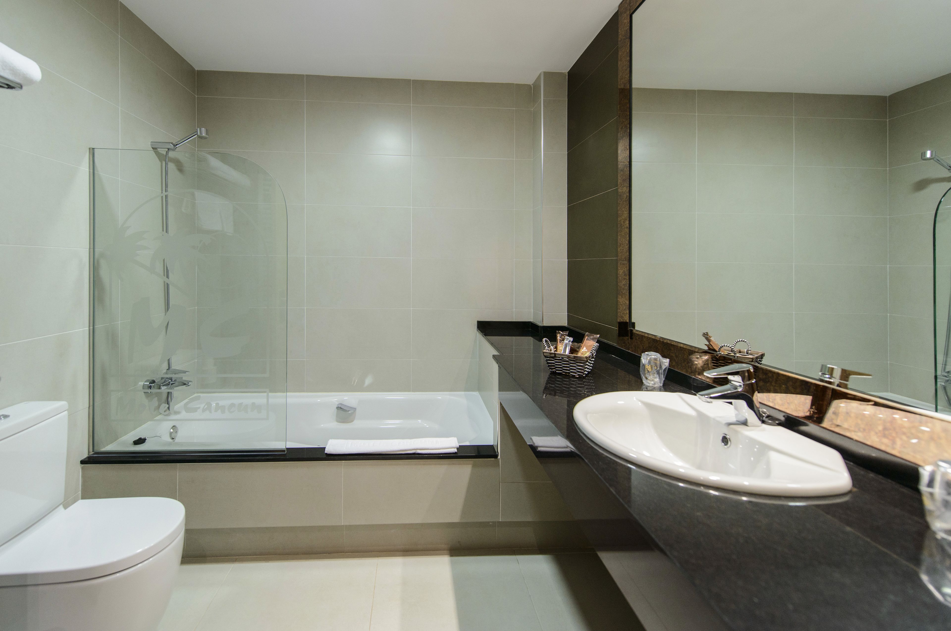 bathtub, free toiletries, slippers, bidet