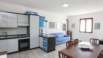 Apartment, 2 Bedrooms | Private kitchen | Full-size fridge, oven, stovetop, cookware/dishes/utensils