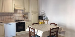 Apartment, 2 Bedrooms | Private kitchen | Full-sized fridge, oven, stovetop, cookware/dishes/utensils - Central House In Posada (Posada)