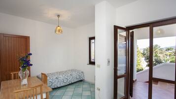 Apartment, 1 Bedroom | Living area | TV