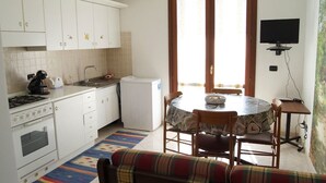 Apartment, 1 Bedroom | Private kitchen | Full-size fridge, oven, stovetop, cookware/dishes/utensils - Painted House (Alghero)