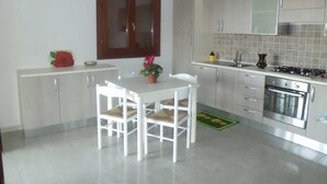 Villa, 4 Bedrooms | Private kitchen | Full-size fridge, oven, stovetop, cookware/dishes/utensils - Le Ville Di Lutturai (San Teodoro)