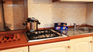 Apartment, 1 Bedroom | Private kitchen | Espresso maker, full-size fridge, oven, stovetop - Apartments Gaudi' (Alghero)