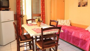 Apartment, 1 Bedroom | Living area | Flat-screen TV - Apartments Gaudi' (Alghero)