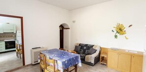 Departamento, 1 habitación | Área de sala de estar | Televisión de pantalla plana 