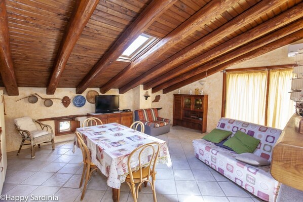 Apartment, 1 Bedroom | Living area | Flat-screen TV, fireplace