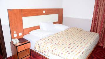 Classic Room | Minibar, in-room safe, individually decorated, individually furnished