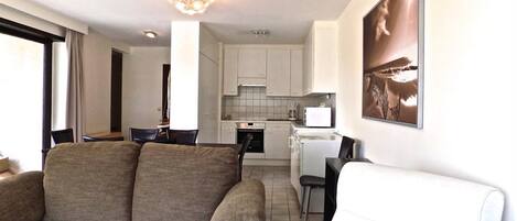 Apartment, 3 Bedrooms | Living area | Flat-screen TV, DVD player