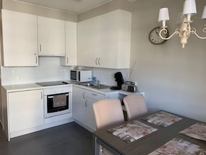 Apartment | Private kitchen | Fridge, microwave, stovetop, coffee/tea maker