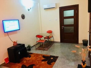Apartment, 1 Bedroom | Living area | Flat-screen TV - Vertex Realty Apartment Oniru (Lagos)