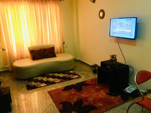 Apartment, 1 Bedroom | Living area | Flat-screen TV