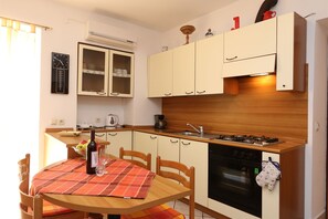 Fridge, coffee/tea maker, cookware/dishes/utensils