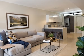 Apartamento exclusivo | Área de estar | TV de tela plana