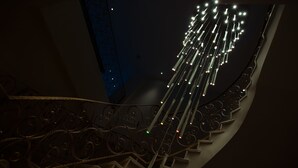 A staircase with ornate metal railings and a series of lights at the top. - Holiday Inn Aktau - Seaside by IHG (Aktau)