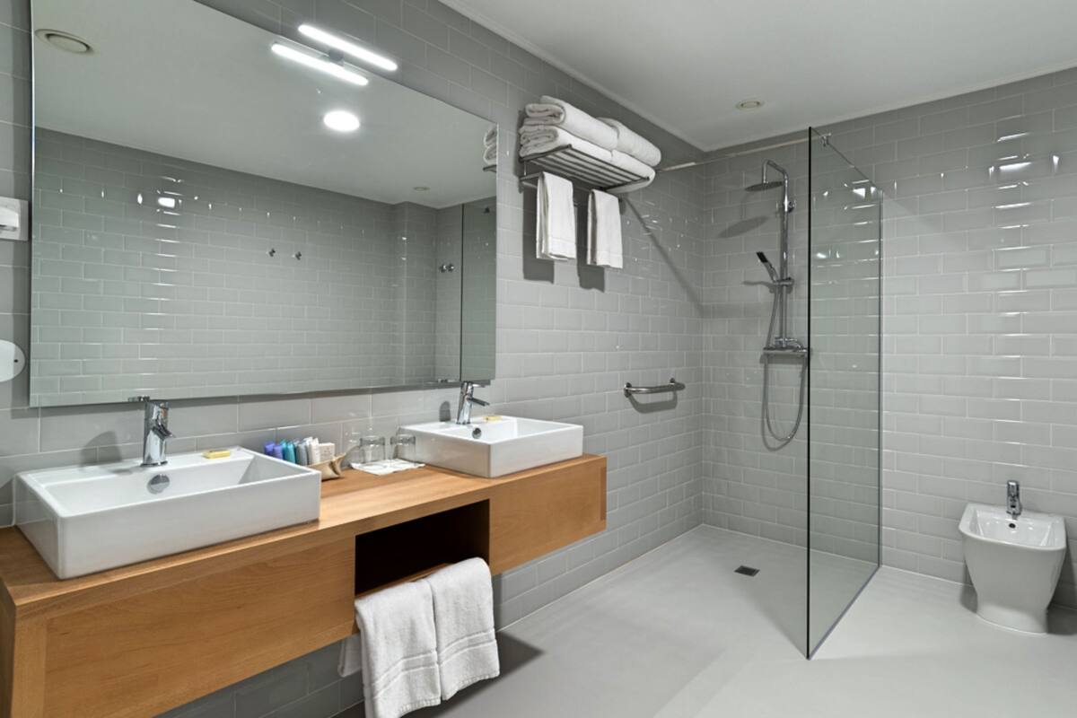 junior suite (ecola) | bathroom | designer toiletries, hair dryer, bathrobes, slippers