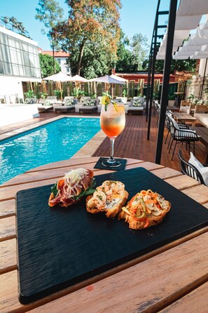 Seasonal outdoor pool, pool umbrellas, pool loungers