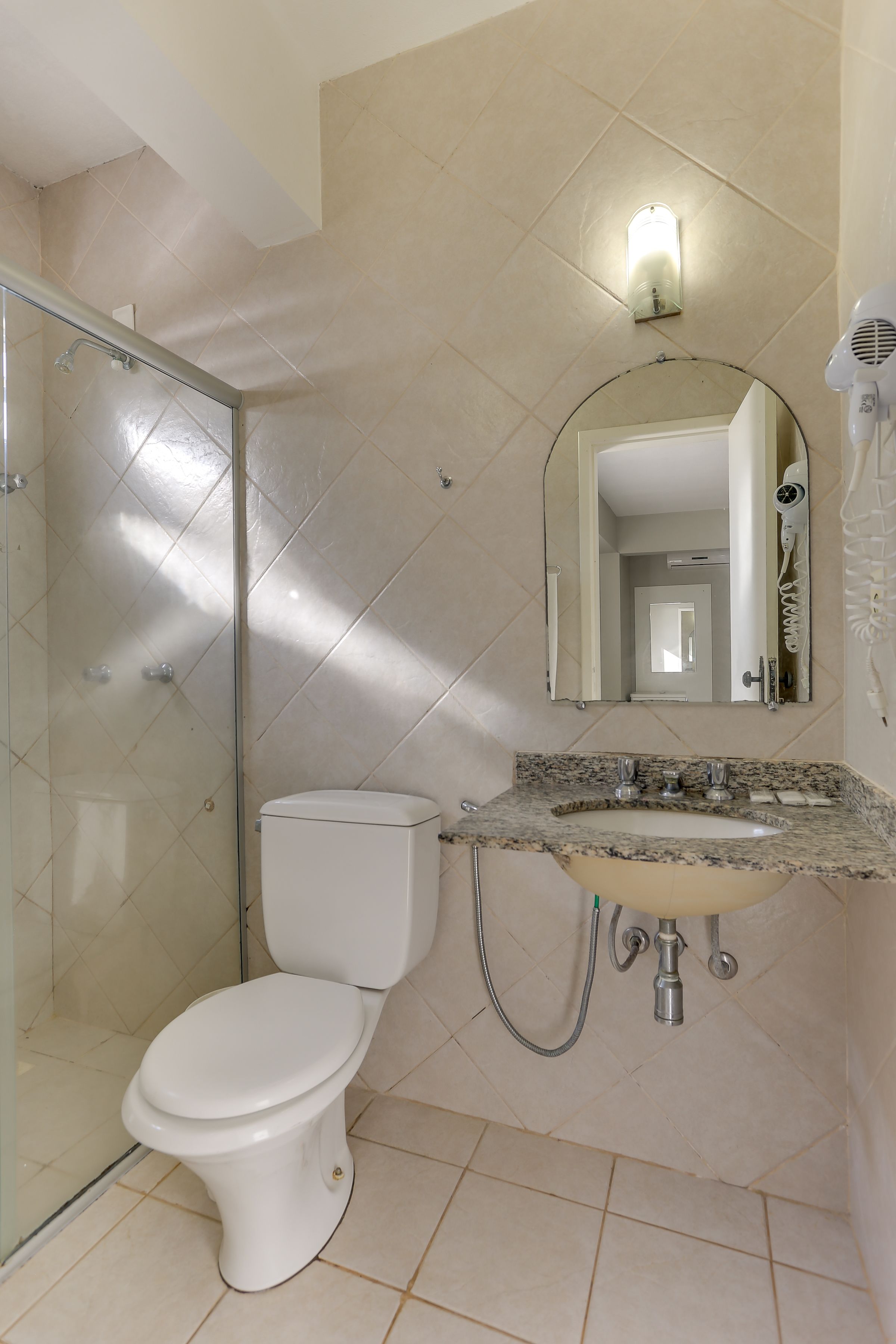 basic quadruple room, beach view, beachfront | bathroom | shower, towels, soap, toilet paper