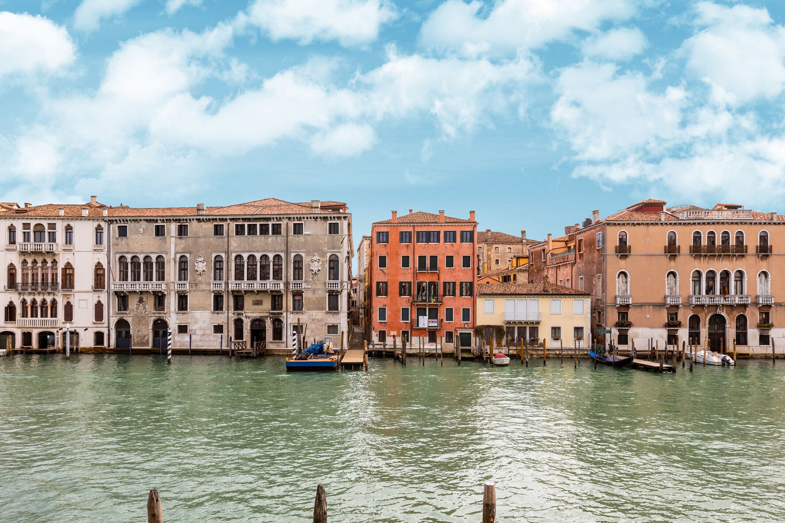 A canal with historic buildings and boats.