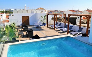 Outdoor pool, open 9:00 AM to 9:00 PM, pool loungers