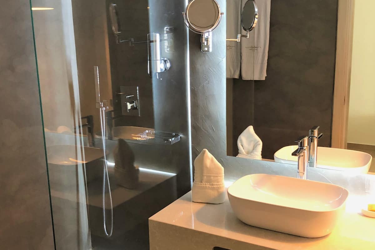 superior double room, city view | bathroom | shower, hair dryer, towels, soap