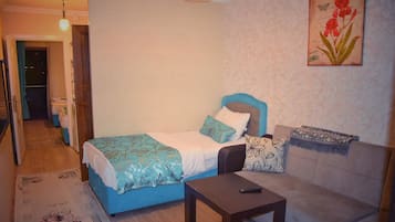 Departamento familiar, 2 habitaciones, vista al lago, junto al lago | Área de sala de estar